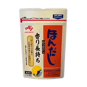 Soup Stock Hondashi packaging with authentic Japanese branding. Prepared miso soup using Soup Stock Hondashi as a base. Soup Stock Hondashi sprinkled over vegetables for enhanced umami flavor.